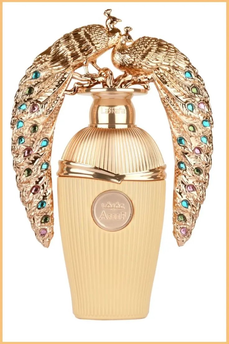 Lattafa AFEEF 100ml by Royal Oud Perfumes comes in a gold bottle with two ornate, jewel-encrusted peacocks facing each other. The ribbed texture and embossed label evoke the allure of classic perfume arabe.