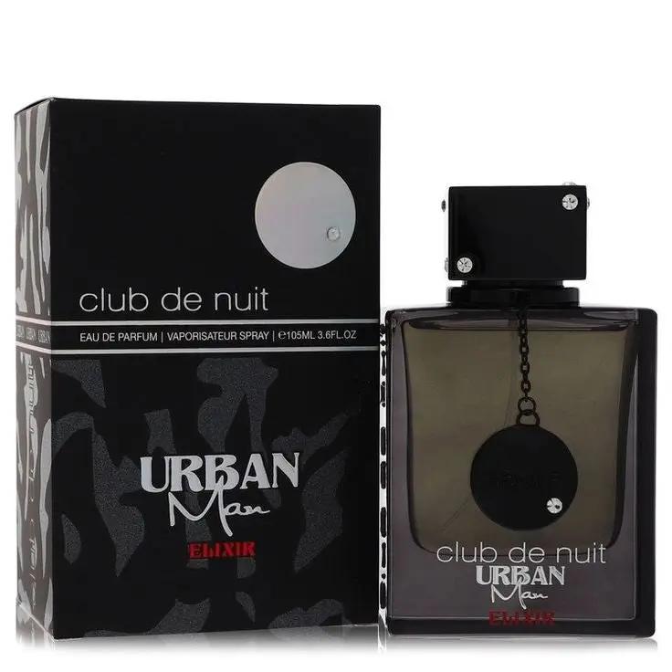 A bottle and box of Armaf Club de Nuit URBAN MAN ELIXIR by Royal Oud Perfumes are displayed side by side, featuring black packaging with silver and red accents. The square bottle has a black cap adorned with a chain and medallion.