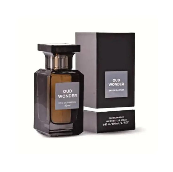 A dark glass bottle of Lattafa OUD WONDER by Royal Oud Perfumes stands beside its matching black rectangular box, both labeled and displayed on a white background.